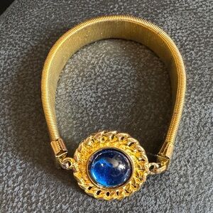 Gold Tone Bracelet with Blue Cabochon Center